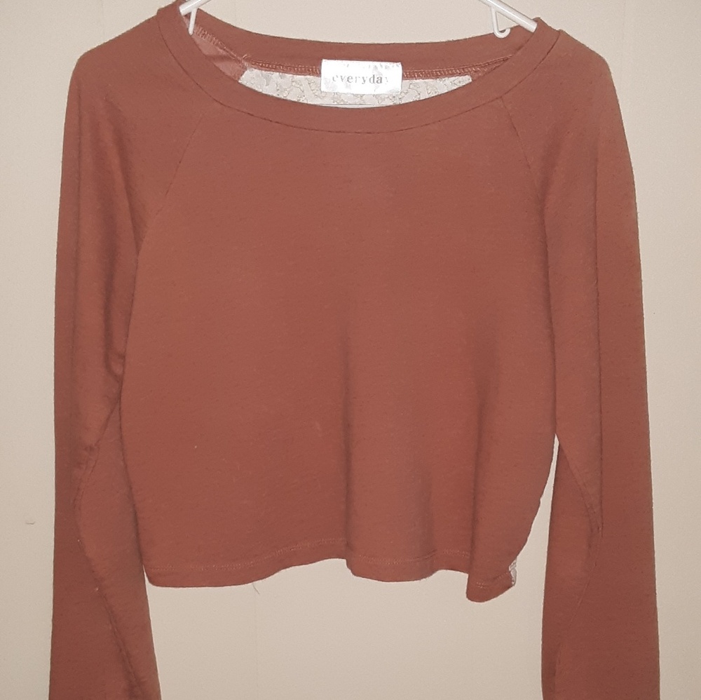 Everyday brand shirt fits like a med. Crop top